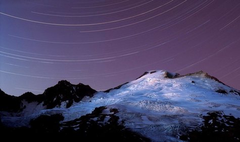 Stars near a mountain at night. Stars near a mountain at night.