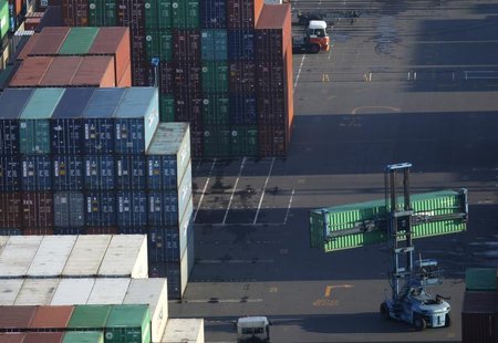 Containers are stacked up at a port in Tokyo January 24, 2013. REUTERS/Yuya Shino Containers are stacked up at a port in Tokyo January 24, 2013. REUTERS/Yuya Shino