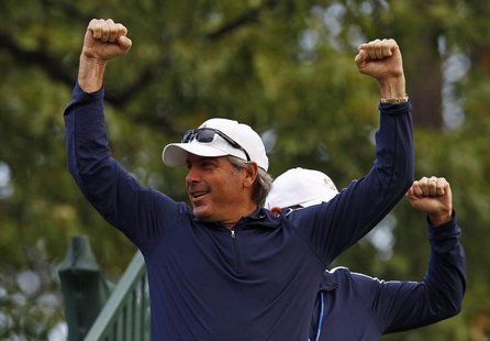 Fred Couples responds to the crowds cheers as the team arrives on the first hole for the start of their practice round at the 39th Ryder Cup Fred Couples responds to the crowds cheers as the team arrives on the first hole for the start of their practice round at the 39th Ryder Cup