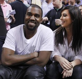 Rap musician Kanye West is seen court side with reality television star Kim Kardashian as the Miami Heat play the New York Knicks in their N Rap musician Kanye West is seen court side with reality television star Kim Kardashian as the Miami Heat play the New York Knicks in their N