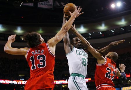 Boston Celtics forward Jeff Green (C) drives to the basket between Chicago Bulls center Joakim Noah (L) and Bulls forward Taj Gibson in the Boston Celtics forward Jeff Green (C) drives to the basket between Chicago Bulls center Joakim Noah (L) and Bulls forward Taj Gibson in the