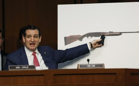 U.S. Senator Ted Cruz, (R-TX), holds a plastic hand grip in front of a picture of a hunting rifle as he questions NRA CEO Wayne LaPierre (no U.S. Senator Ted Cruz, (R-TX), holds a plastic hand grip in front of a picture of a hunting rifle as he questions NRA CEO Wayne LaPierre (no