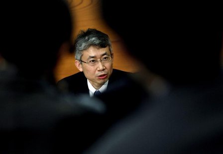 Bank of Japan (BOJ) board member Ryuzo Miyao is seen between reporters as he speaks during a news conference at the BOJ headquarters in Toky Bank of Japan (BOJ) board member Ryuzo Miyao is seen between reporters as he speaks during a news conference at the BOJ headquarters in Toky