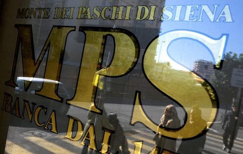 People are reflected in the window of a Monte Dei Paschi Di Siena bank in Rome January 29, 2013. REUTERS/Max Rossi People are reflected in the window of a Monte Dei Paschi Di Siena bank in Rome January 29, 2013. REUTERS/Max Rossi