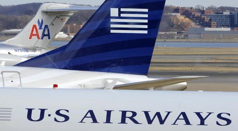 A view of two US Airways Express planes next to an American Airlines plane (background) at the Ronald Reagan Washington National Airport in A view of two US Airways Express planes next to an American Airlines plane (background) at the Ronald Reagan Washington National Airport in