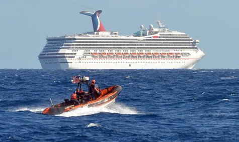 A small boat from the U.S. Coast Guard Cutter Vigorous patrols near the cruise ship Carnival Triumph in the Gulf of Mexico, in this February A small boat from the U.S. Coast Guard Cutter Vigorous patrols near the cruise ship Carnival Triumph in the Gulf of Mexico, in this February