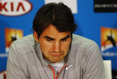 Roger Federer of Switzerland attends a news conference after he was defeated in his men's singles semi-final match by Andy Murray of Britain Roger Federer of Switzerland attends a news conference after he was defeated in his men's singles semi-final match by Andy Murray of Britain