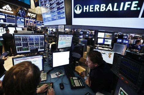 Traders work at the post that trades Herbalife stock on the floor of the New York Stock Exchange in this January 10, 2013 file photograph. R Traders work at the post that trades Herbalife stock on the floor of the New York Stock Exchange in this January 10, 2013 file photograph. R