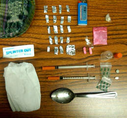 Heroin and drug paraphernalia (courtesy of FOX 11). Heroin and drug paraphernalia (courtesy of FOX 11).
