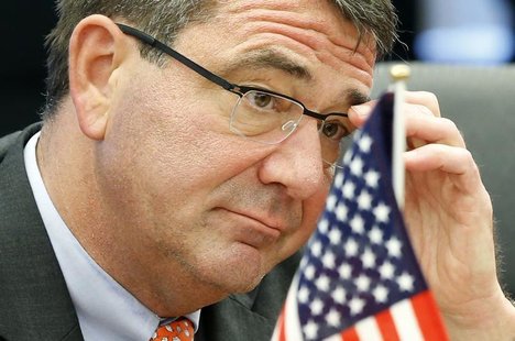 Deputy Secretary of Defense Ashton Carter adjusts his glasses during his meeting with Japanese Senior Vice Defence Minister Shu Watanabe in Deputy Secretary of Defense Ashton Carter adjusts his glasses during his meeting with Japanese Senior Vice Defence Minister Shu Watanabe in
