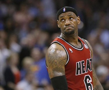 Miami Heat forward LeBron James reacts after being called for a technical foul against the Oklahoma City Thunder in the first half of their Miami Heat forward LeBron James reacts after being called for a technical foul against the Oklahoma City Thunder in the first half of their