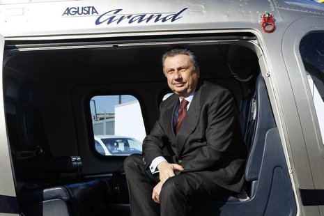 Finmeccanica Chairman and Chief Executive Officer Giuseppe Orsi poses in a helicopter during the opening ceremony of the new Terminal of Ver Finmeccanica Chairman and Chief Executive Officer Giuseppe Orsi poses in a helicopter during the opening ceremony of the new Terminal of Ver