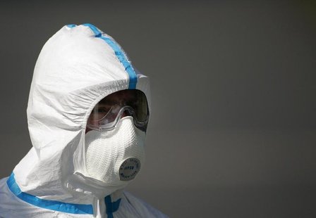 A worker in a bio-hazard suit poses to the media at the entry of a poultry farm in Wachenroth, southern Germany in this file photo taken Aug A worker in a bio-hazard suit poses to the media at the entry of a poultry farm in Wachenroth, southern Germany in this file photo taken Aug