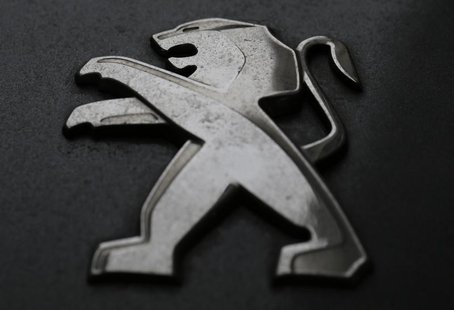 A company logo is seen on a Peugeot car parked in Paris, February 12, 2013. French carmaker PSA Peugeot Citroen is due to post its 2012 resu A company logo is seen on a Peugeot car parked in Paris, February 12, 2013. French carmaker PSA Peugeot Citroen is due to post its 2012 resu