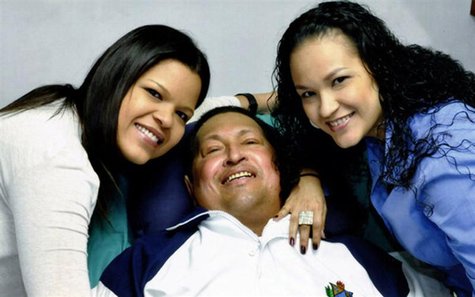 Venezuela's President Hugo Chavez smiles in between his daughters, Rosa Virginia (R) and Maria while recovering from cancer surgery in Havan Venezuela's President Hugo Chavez smiles in between his daughters, Rosa Virginia (R) and Maria while recovering from cancer surgery in Havan
