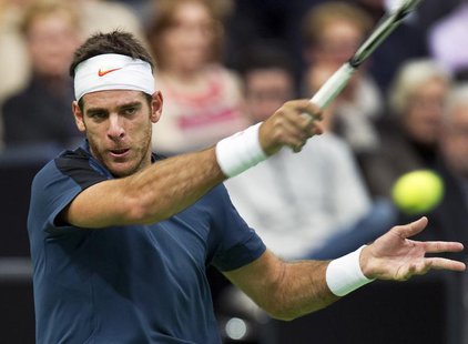 Juan Martin Del Potro of Argentina hits a forehand to Grigor Dimitrov of Bulgaria during their men's singles semi-final tennis match at the Juan Martin Del Potro of Argentina hits a forehand to Grigor Dimitrov of Bulgaria during their men's singles semi-final tennis match at the