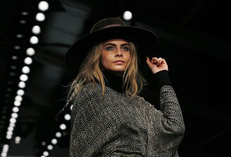 Model Cara Delevingne presents a creation from the Issa Autumn/Winter 2013 collection during London Fashion Week, February 16, 2013. REUTERS Model Cara Delevingne presents a creation from the Issa Autumn/Winter 2013 collection during London Fashion Week, February 16, 2013. REUTERS