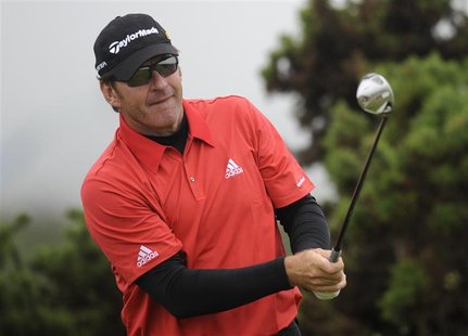 Nick Faldo of England watches his tee shot on the 10th hole during first round play at the British Open golf championship on the Old Course Nick Faldo of England watches his tee shot on the 10th hole during first round play at the British Open golf championship on the Old Course