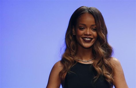 Singer Rihanna walks out onto the catwalk after the presentation of her Rihanna for River Island Autumn/Winter 2013 collection during London Singer Rihanna walks out onto the catwalk after the presentation of her Rihanna for River Island Autumn/Winter 2013 collection during London