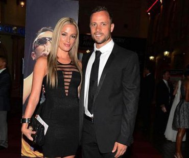 Oscar Pistorius (R) and his girlfriend Reeva Steenkamp pose for a picture in Johannesburg, February 7, 2013. South African ''Blade Runner'' Oscar Pistorius, a double amputee who became one of the biggest names in world athletics, was charged on February 14, with shooting dead his girlfriend at his home in Pretoria. REUTERS/Thembani Makhubele Oscar Pistorius (R) and his girlfriend Reeva Steenkamp pose for a picture in Johannesburg, February 7, 2013. South African ''Blade Runner'' Oscar Pistorius, a double amputee who became one of the biggest names in world athletics, was charged on February 14, with shooting dead his girlfriend at his home in Pretoria. REUTERS/Thembani Makhubele