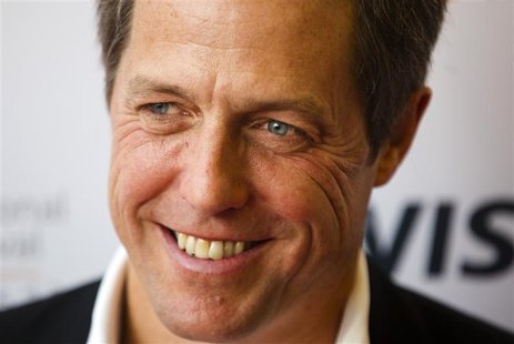 Actor Hugh Grant arrives on the red carpet for the gala presentation of the film "Cloud Atlas" at the 37th Toronto International Film Festiv Actor Hugh Grant arrives on the red carpet for the gala presentation of the film "Cloud Atlas" at the 37th Toronto International Film Festiv