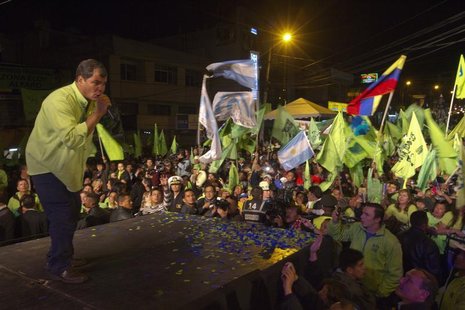 Ecuador's President Rafael Correa (L) addresses supporters during his final closing political rally in Quito February 14, 2013. Correa, one Ecuador's President Rafael Correa (L) addresses supporters during his final closing political rally in Quito February 14, 2013. Correa, one