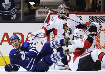 Toronto Maple Leafs Frazer McLaren (L) celebrates his goal against Ottawa Senators goalie Craig Anderson (C) and Marc Methot during the firs Toronto Maple Leafs Frazer McLaren (L) celebrates his goal against Ottawa Senators goalie Craig Anderson (C) and Marc Methot during the firs