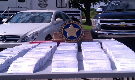 Seized fraudulent tax mailings are displayed during a news conference in Tampa, Florida, in this undated police handout photo. Tax identity Seized fraudulent tax mailings are displayed during a news conference in Tampa, Florida, in this undated police handout photo. Tax identity