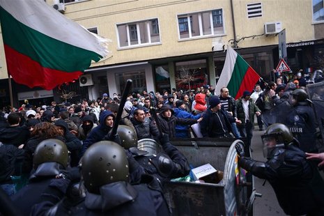 People challenge the riot police as they block traffic during a protest against high electricity bills in Sofia February 17, 2013. REUTERS/T People challenge the riot police as they block traffic during a protest against high electricity bills in Sofia February 17, 2013. REUTERS/T