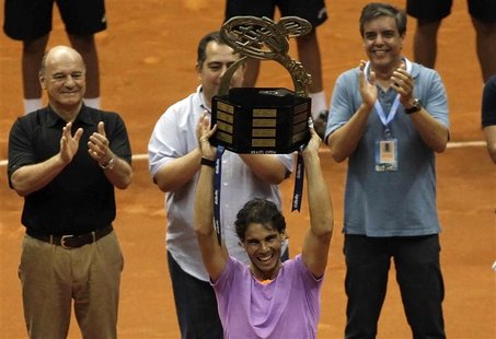 Rafael Nadal of Spain holds up the trophy after winning his final match against David Nalbandian of Argentina at the Brazil Open tennis tour Rafael Nadal of Spain holds up the trophy after winning his final match against David Nalbandian of Argentina at the Brazil Open tennis tour