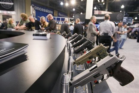 Sig Sauer handguns are displayed during the annual SHOT (Shooting, Hunting, Outdoor Trade) Show in Las Vegas January 15, 2013. REUTERS/Las V Sig Sauer handguns are displayed during the annual SHOT (Shooting, Hunting, Outdoor Trade) Show in Las Vegas January 15, 2013. REUTERS/Las V