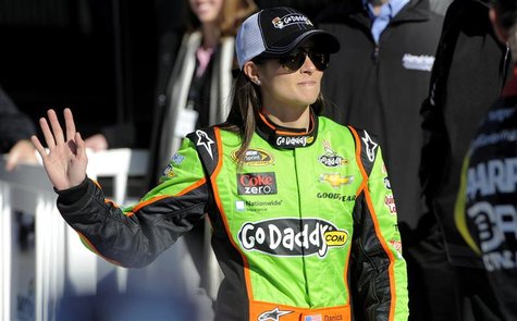 NASCAR Sprint Cup Series driver Danica Patrick, of the number 10 car, waves to the crowd as she makes her way into victory lane to celebrate NASCAR Sprint Cup Series driver Danica Patrick, of the number 10 car, waves to the crowd as she makes her way into victory lane to celebrate