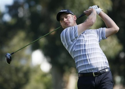 John Merrick of the U.S. tees off on the second hole during the final round of the Northern Trust Open golf tournament at Riviera Country Cl John Merrick of the U.S. tees off on the second hole during the final round of the Northern Trust Open golf tournament at Riviera Country Cl