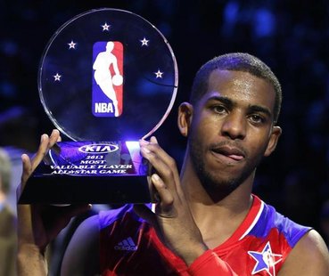 NBA All-Star Chris Paul of the Los Angeles Clippers holds up the MVP trophy after the 2013 NBA All-Star basketball game in Houston, Texas, F NBA All-Star Chris Paul of the Los Angeles Clippers holds up the MVP trophy after the 2013 NBA All-Star basketball game in Houston, Texas, F