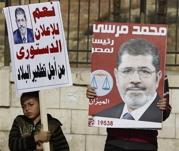 Muslim Brotherhood members and supporters of Egyptian President Mohamed Mursi chant pro-Mursi slogans, during a rally in front of the Sultan Muslim Brotherhood members and supporters of Egyptian President Mohamed Mursi chant pro-Mursi slogans, during a rally in front of the Sultan