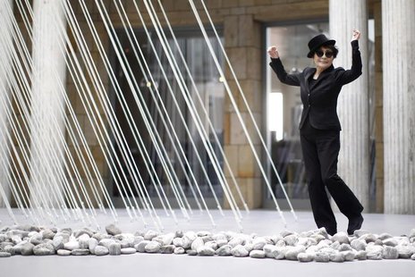 Japanese artist Yoko Ono dances next to art pieces "river bed and morning beams" during the opening of the exhibition "Half-a-wind show. A r Japanese artist Yoko Ono dances next to art pieces "river bed and morning beams" during the opening of the exhibition "Half-a-wind show. A r