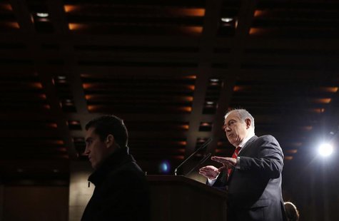 Israel's Prime Minister Benjamin Netanyahu (R) addresses a meeting of the Jewish Agency's Board of Governors in Jerusalem February 18, 2013. Israel's Prime Minister Benjamin Netanyahu (R) addresses a meeting of the Jewish Agency's Board of Governors in Jerusalem February 18, 2013.