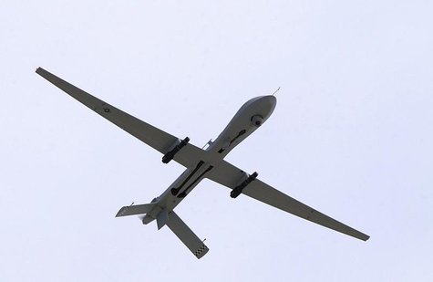 A U.S. Air Force MQ-1 Predator, unmanned aerial vehicle, armed with AGM-114 Hellfire missiles, performs a low altitude pass during the Aviat A U.S. Air Force MQ-1 Predator, unmanned aerial vehicle, armed with AGM-114 Hellfire missiles, performs a low altitude pass during the Aviat