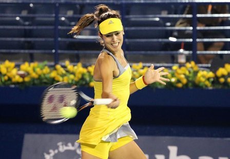 Ana Ivanovic of Serbia hits a return to Anastasia Pavlyuchenkova of Russia during their women's singles match at the WTA Dubai Tennis Champi Ana Ivanovic of Serbia hits a return to Anastasia Pavlyuchenkova of Russia during their women's singles match at the WTA Dubai Tennis Champi