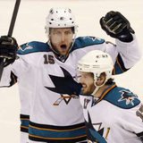 DIFFERENT UNIFORMS, SAME REACTION: Torrey Mitchell (17) and Dany Heatley (15) celebrate a San Jose Sharks goal against the Detroit Red Wings during 2011 Stanley Cup Playoff Action. The two teamed up to score against the Wings for the Minnesota Wild in a 3-2 win on Feb. 17, 2013. REUTERS/Rebecca Cook