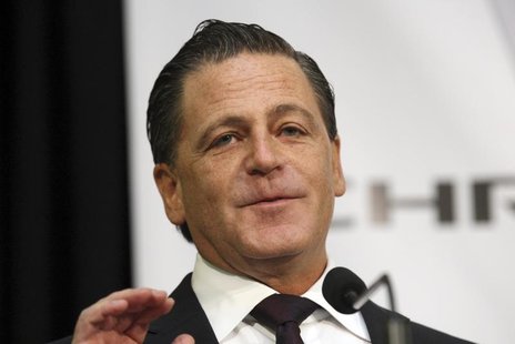 Dan Gilbert, chairman of Rock Ventures and Quicken Loans, addresses the crowd during an announcement that Chrysler Group will move some of i Dan Gilbert, chairman of Rock Ventures and Quicken Loans, addresses the crowd during an announcement that Chrysler Group will move some of i
