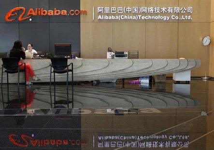 An employee serves a guest at the reception counter inside the headquarters office of Alibaba (China) Technology Co. Ltd on the outskirts of An employee serves a guest at the reception counter inside the headquarters office of Alibaba (China) Technology Co. Ltd on the outskirts of