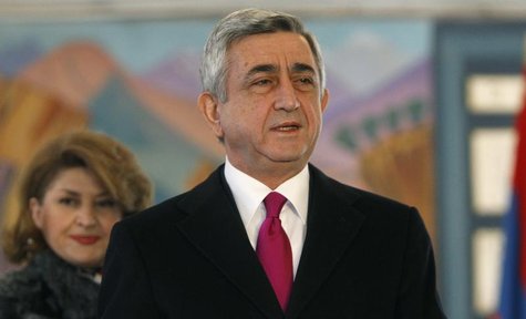Armenia's current President Serzh Sarksyan (R) and his wife Rita leave a polling station after voting during the presidential election in Ye Armenia's current President Serzh Sarksyan (R) and his wife Rita leave a polling station after voting during the presidential election in Ye