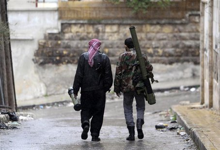 Members of the Free Syrian Army walk with their weapons in Al Izaa district in Aleppo February 16, 2013. REUTERS/Muzaffar Salman Members of the Free Syrian Army walk with their weapons in Al Izaa district in Aleppo February 16, 2013. REUTERS/Muzaffar Salman