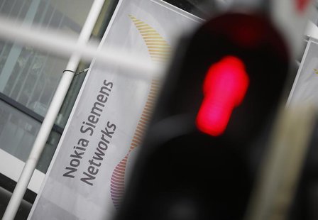 A red traffic light is pictured next to the company logo of Mobile network equipment maker Nokia Siemens Networks (NSN), in Munich November A red traffic light is pictured next to the company logo of Mobile network equipment maker Nokia Siemens Networks (NSN), in Munich November
