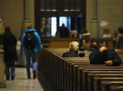 Catholics pray during a mass at St. Patrick's Cathedral in New York, February 11, 2013. REUTERS/Brendan McDermid Catholics pray during a mass at St. Patrick's Cathedral in New York, February 11, 2013. REUTERS/Brendan McDermid