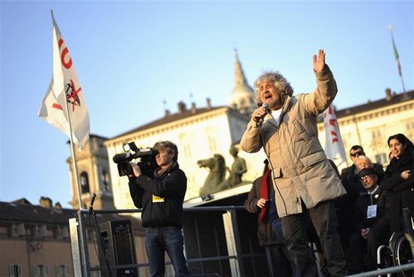 Five-Star Movement leader and comedian Beppe Grillo (front L) gestures during a rally in Turin February 16, 2013. REUTERS/Giorgio Perottino Five-Star Movement leader and comedian Beppe Grillo (front L) gestures during a rally in Turin February 16, 2013. REUTERS/Giorgio Perottino