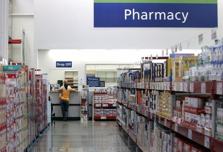 A customer leans against the pharmacy counter in Arkansas May 31, 2007. REUTERS/Jessica Rinaldi A customer leans against the pharmacy counter in Arkansas May 31, 2007. REUTERS/Jessica Rinaldi