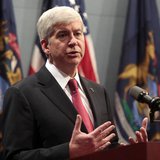 Michigan Governor Rick Snyder holds a news conference to talk about why he signed into law, earlier in the day, right-to-work laws in Lansin