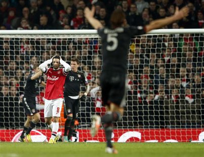 Arsenal's Mikel Arteta reacts after Bayern Munich scored a third goal during their Champions League soccer match at the Emirates Stadium in Arsenal's Mikel Arteta reacts after Bayern Munich scored a third goal during their Champions League soccer match at the Emirates Stadium in